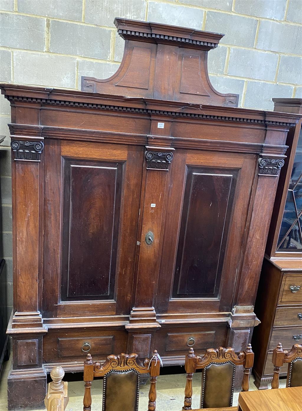 A large early 18th century German mahogany Schrank, width 190cm, depth 71cm, height 267cm